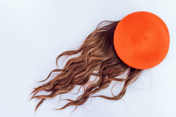 wig with an orange beret